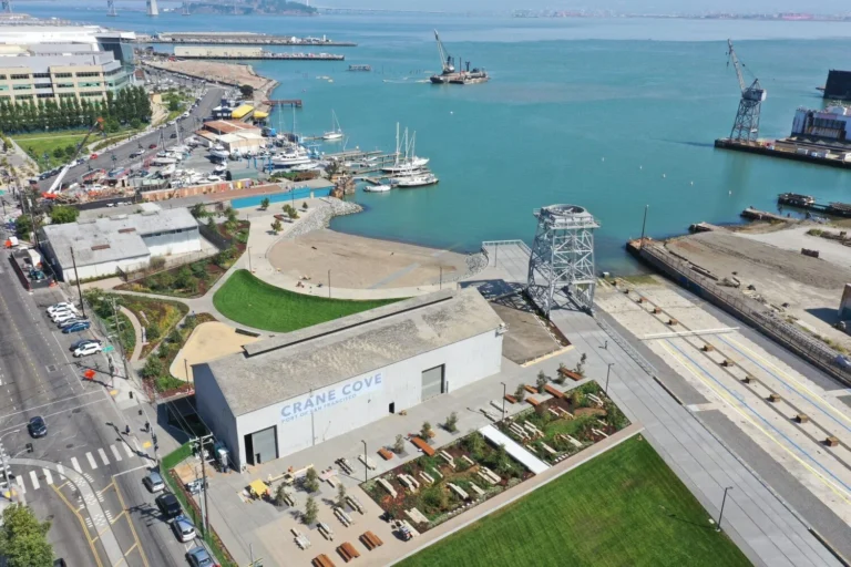 An aerial view of the shipyard, the dry dock and the pier.