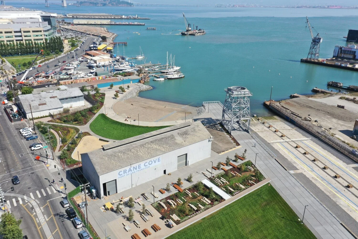 An aerial view of the shipyard, the dry dock and the pier.