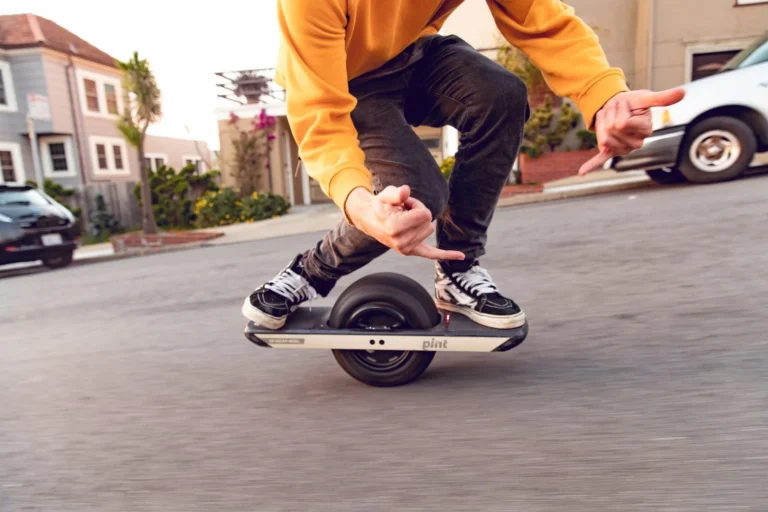 A rider on a Onewheel board on a San Francisco street.