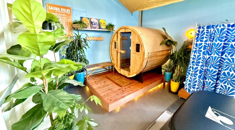 The barrel sauna at Crane Cove, the deck in front of it and the towel rail beside.